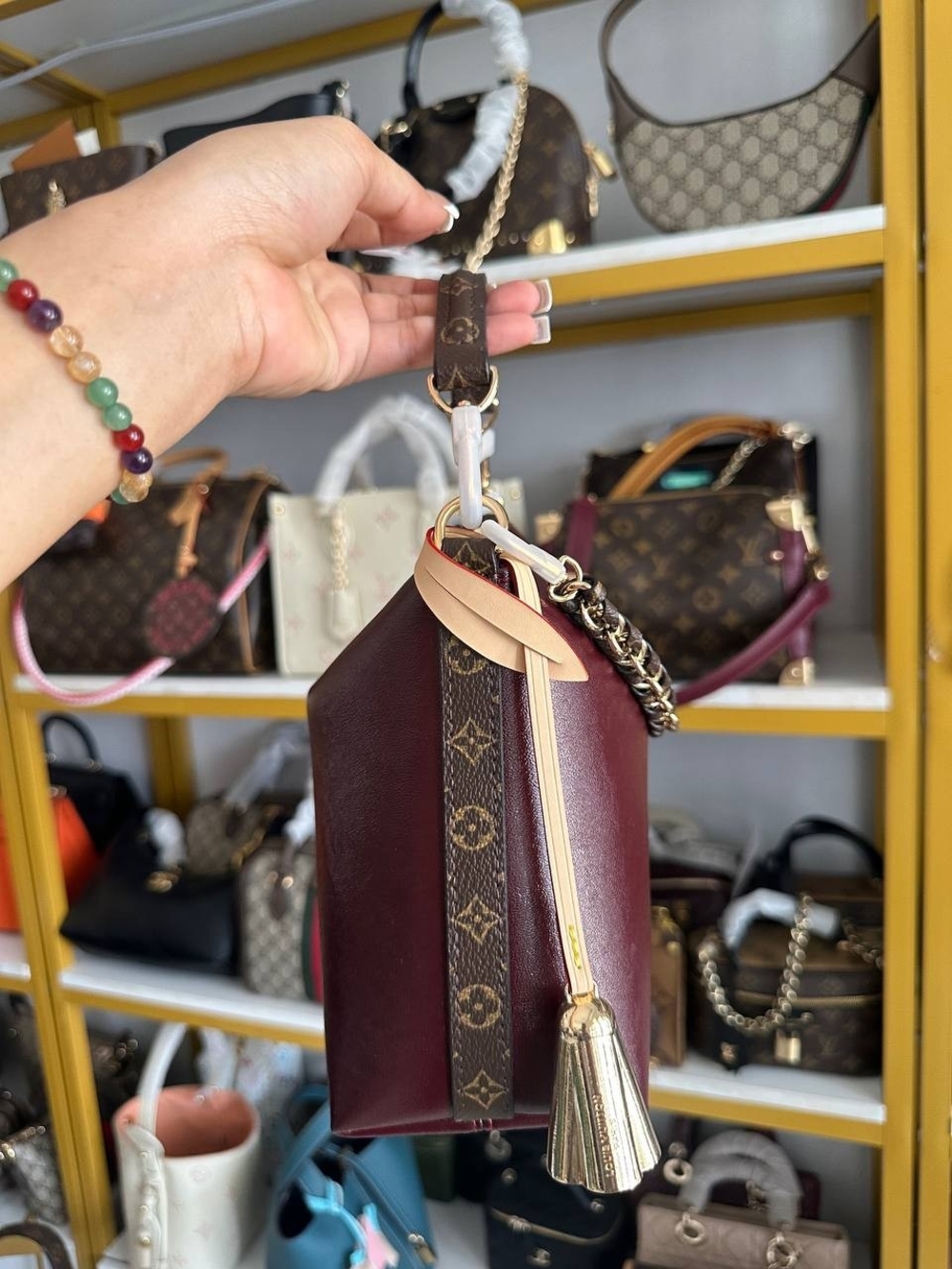 Louis Vuitton Burgundy and Tan Monogram Mini Bag with Gold Tassel